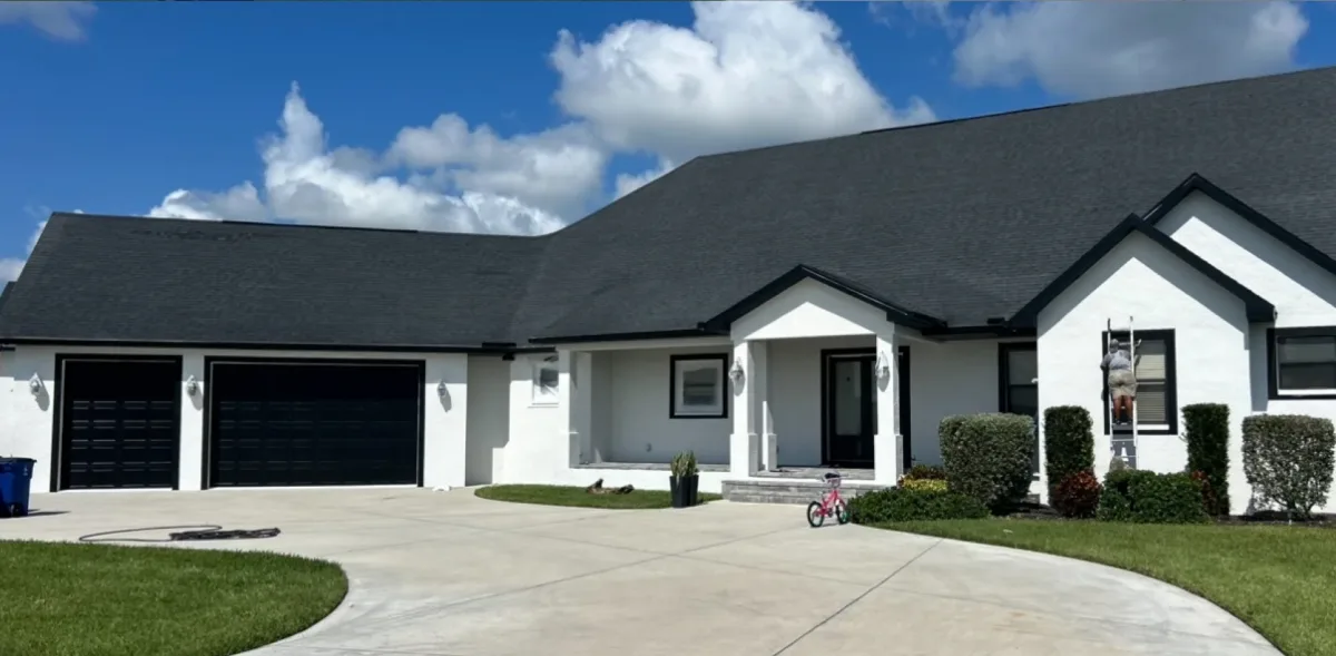 White home exterior with black trim after repaint by Sergeant Painters