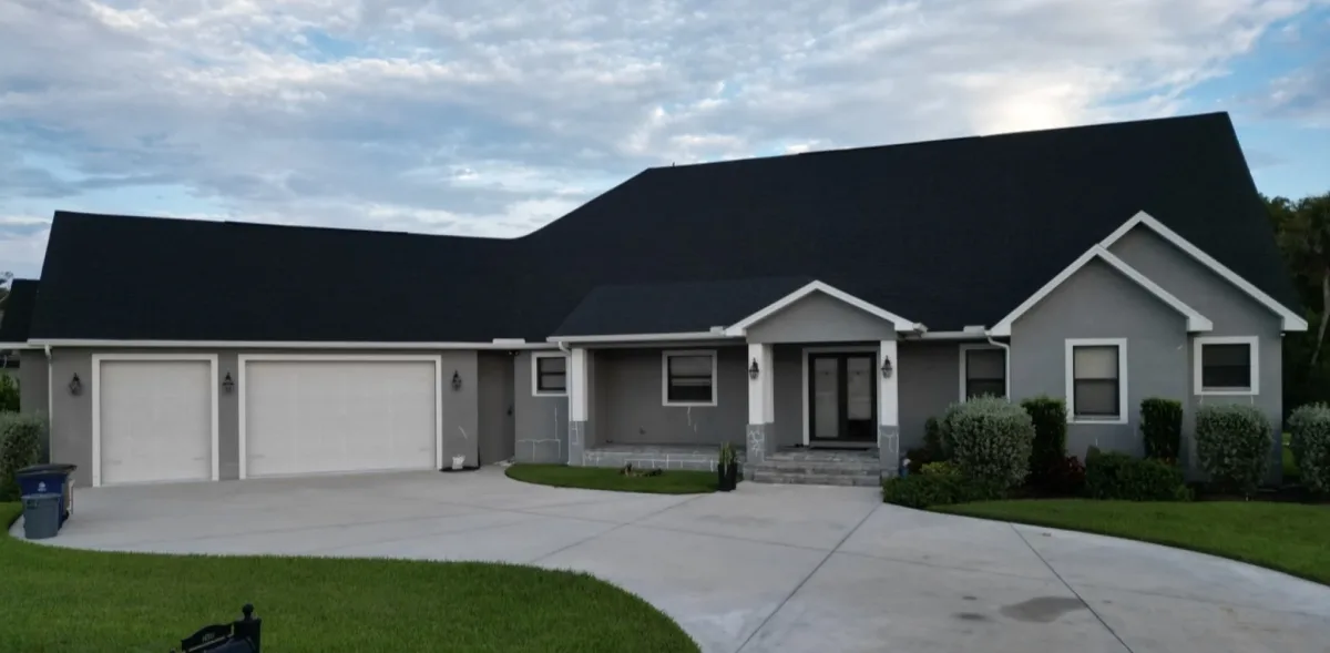 Gray home exterior before full repaint in Fort Myers FL
